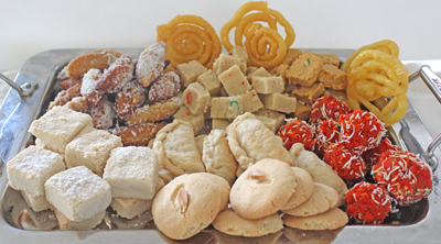 A tray of delicious poli, channa magaj, burfi, jelebis, shortbread, naan khatai, and goolab jamum, diwali treats