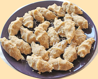 A Plate of Kolcata, a delicous dessert that has is pressed by hand to leave an imprint of the fingers clasping